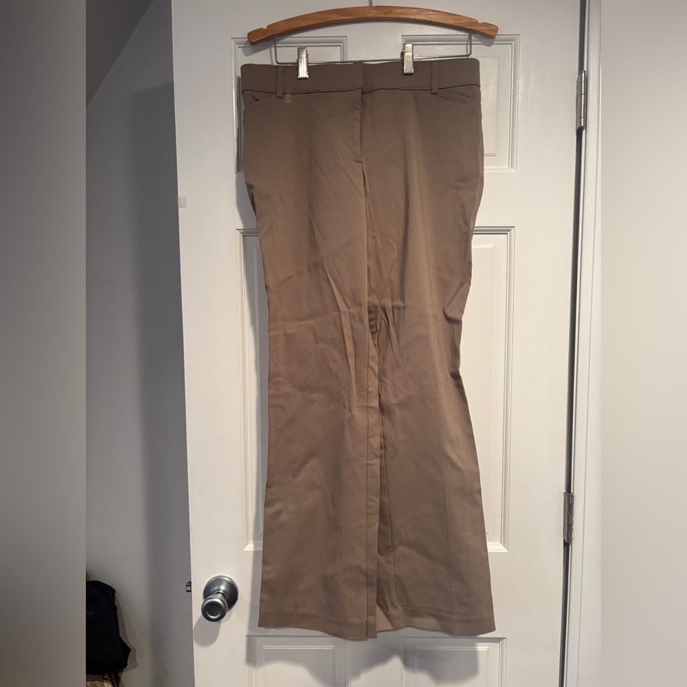 Tan pants with small pockets on the side 
No back pockets